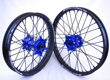 SMPro-platinum cross rims blue hubs with black spokes and blue nippels